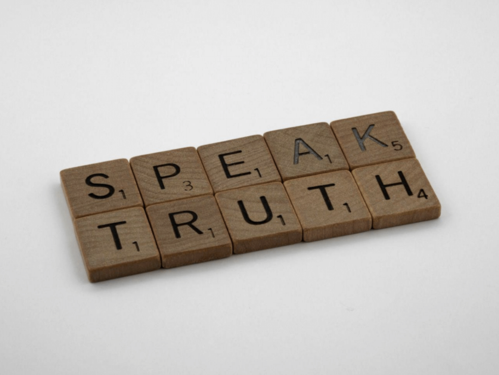 'Speak Truth' spelled out in scrabble letters